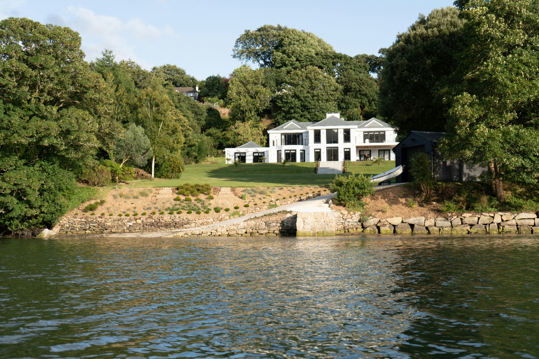 Luxury white house with waterfront view in Cornwall